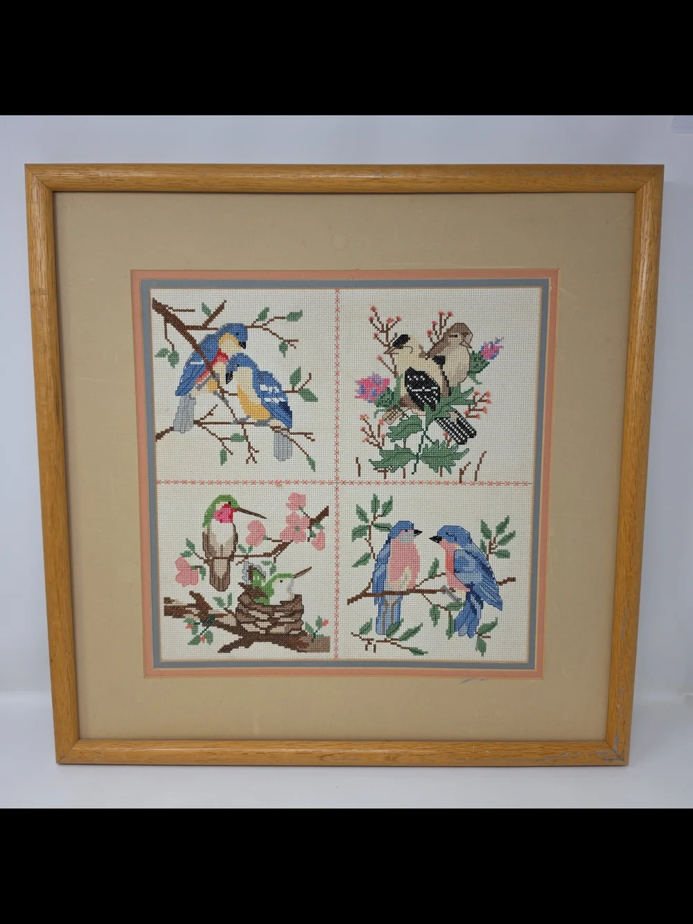 Framed Four-Panel Bird Cross-Stitch Wall Art in Blue, Pink & Green